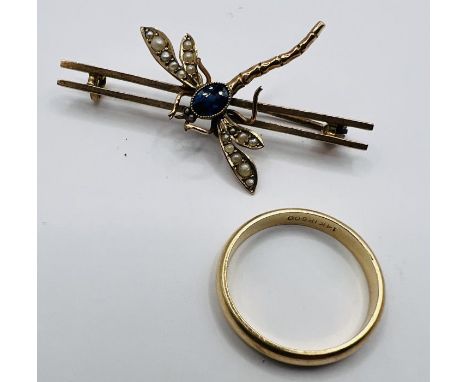 A dragonfly bar brooch, set with sapphire and seed pearls and stamped 9ct. Along with a "14k" stamped yellow metal band ring.