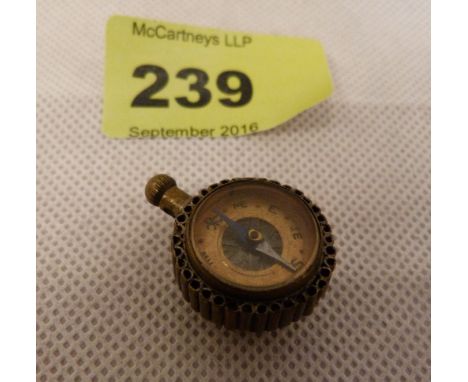 An early 20th century compass and faux watch pendant