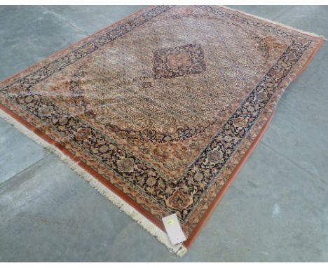 An eastern style wool carpet. 110'' x 80''