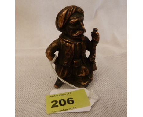 A figural  go-to-bed light cast in the form of a Turkish soldier. 3¼'' high