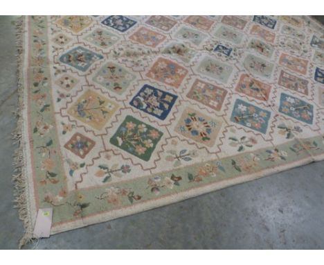 An Indian cream ground carpet. 160'' x 126''