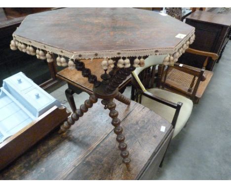 A 19th century walnut bobbin turned cricket table. The octagonal top painted with ferns. 21'' wide