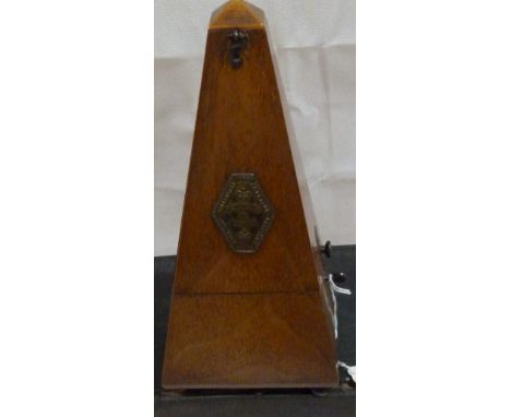 A Belgian mahogany metronome. 9'' high