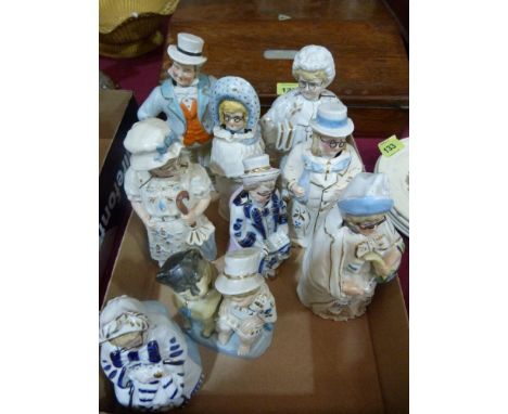 Nine ceramic figures with nodding heads