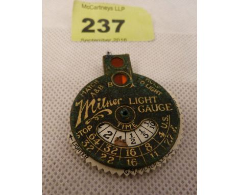 A Milner light gauge in a leather pouch