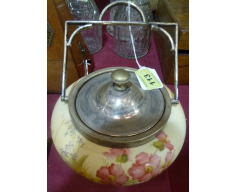 A Royal Worcester biscuit barrel painted in colours with flowers on a blush ground. Plated mounts. C.1900
