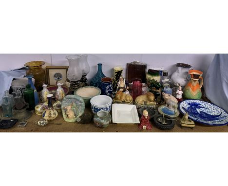 A silver photograph frame together with a Royal Doulton figure Little Pig, a choir boy, Old King Cole, recumbent lions, cranb