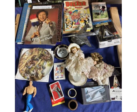 A chrome plated table lighter in the form of a fighter jet together with an eagle comic, programmes, annuals, plates etc