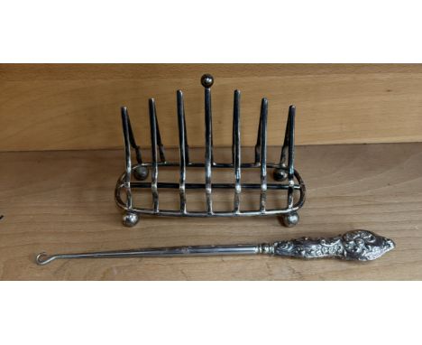 A George V silver six division toast rack, Sheffield, 1908, John Round & Son Ltd together with a silver handled button hook
