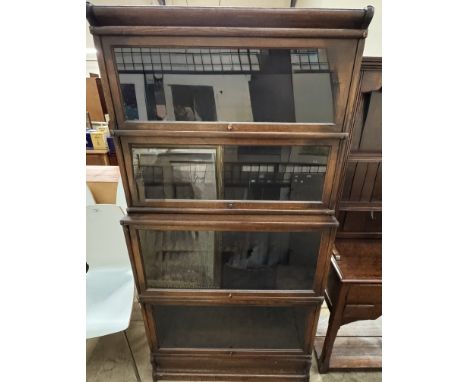 An oak four section Globe Wernicke glass fronted bookcase 
