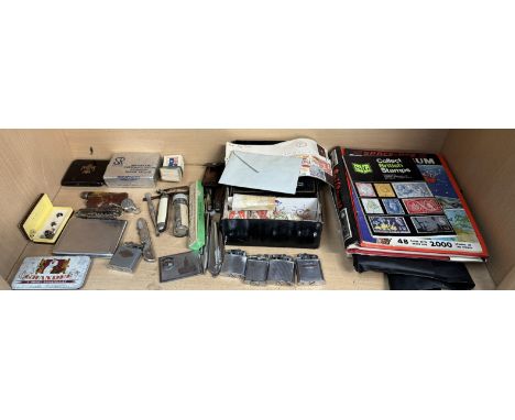 Assorted lighters, pocket knives, shirt studs, cigarette cards, faux tortoiseshell cigarette case, stamps etc 