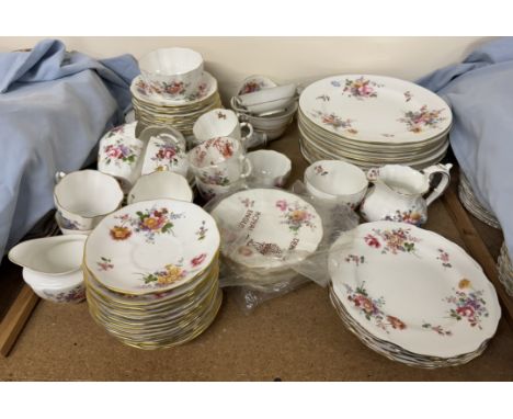 A Royal Crown Derby matched part tea and dinner service decorated in garden flowers 