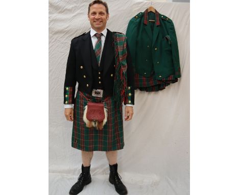A Welsh wool black jacket with tails having St David's tartan on the sleeves with matching black waistcoat with the St David'