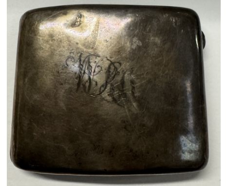 A silver cigarette case of rectangular form, with initials 