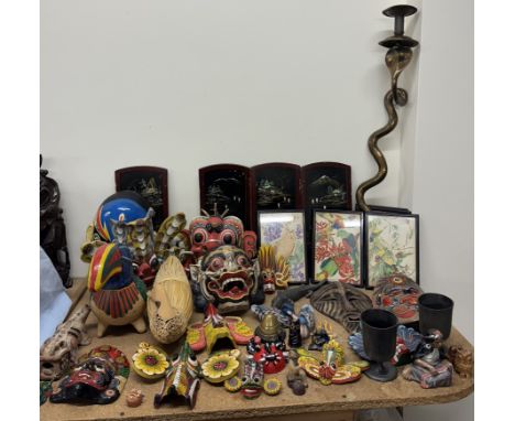 A collection of carved wooden masks together with parts of a four fold scree, cobra candlestick, bird prints etc 