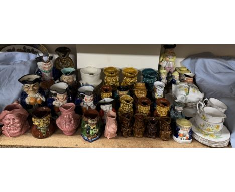 A Royal Albert Daffodil pattern part tea service together with a large collection of character and toby jugs