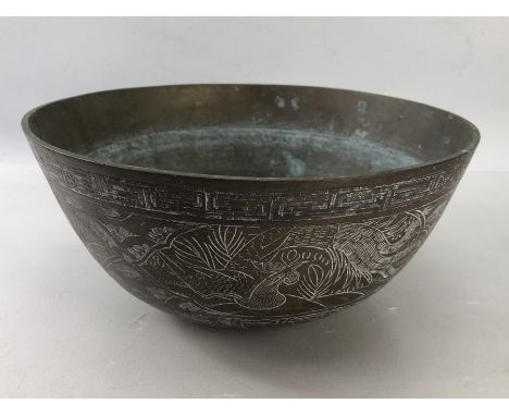 Chinese Bronze Bowl with engraved dragons and classic freeze to edge. Six figure character mark to base approx 24cm Diameter 