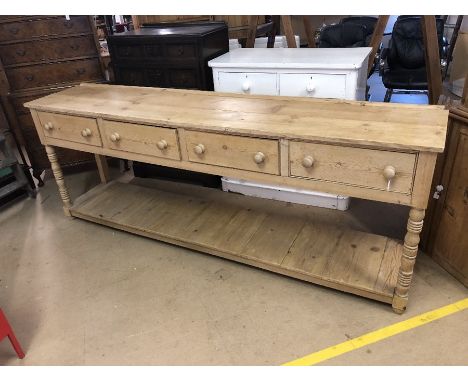 Very large pine farmhouse kitchen sideboard with four large drawers and shelf under, on turned front legs, approx 245cm x 50c