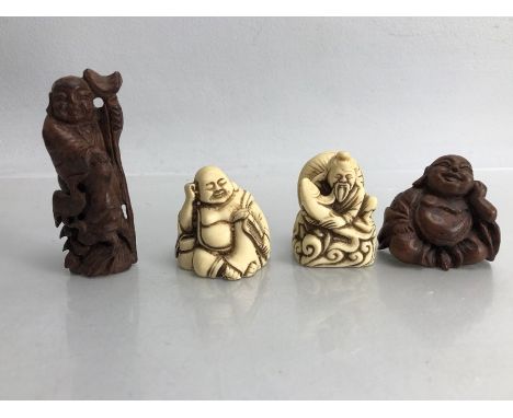 Collection of four netsuke two carved bone and two carved wooden figurines