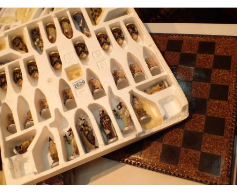 Fantasy themed chess set with witches wizards dragons etc  CONDITION REPORT: Tallest piece 11 cm.