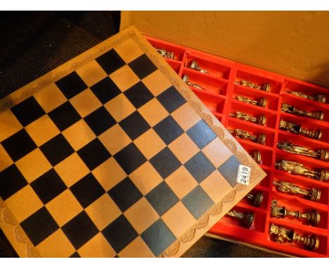 Indian figural chess set with brass and white metal pieces and board H: 13 cm