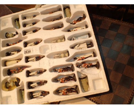Napoleon themed resin chess set with board CONDITION REPORT: Tallest piece is 13 cm.