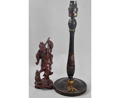 A Laquered Wooden Chinoiserie Table Lamp and a Carved Wooden Chinese Figure of a Fisherman, Lamp 35cms High 