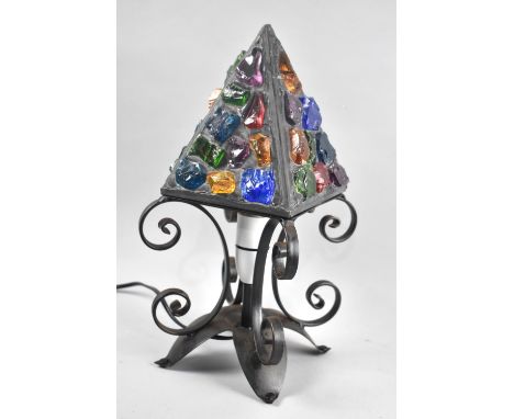 A Mid 20th century Wrought Iron and Coloured Glass Table Lamp with Pyramid Shade, 33cms High 