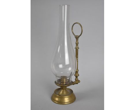 A Vintage Brass Candlestick with Ring Handle and Tall Plain Glass Chimney, 31cms High 