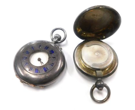 A silver fob watch, with outer case marked with blue enamel Roman numerals, and bearing figure of a stag to reverse, 43g, tog