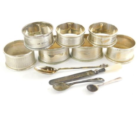 A collection of small silver, to include various napkin rings, some with engine turned decoration, two salt spoons, a coffee 