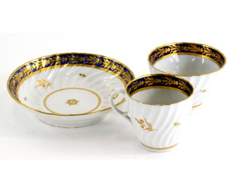 A late 18thC English porcelain trio, comprising tea bowl, saucer and tea cup, 6cm high, each in ribbed pattern with an interi