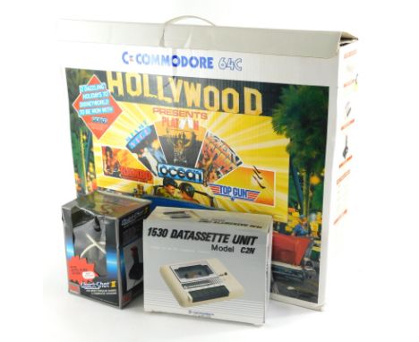 A vintage Commodore C64 boxed Hollywood set of boxed joystick, user manual, units, wires, etc., the outer box 60cm wide. 