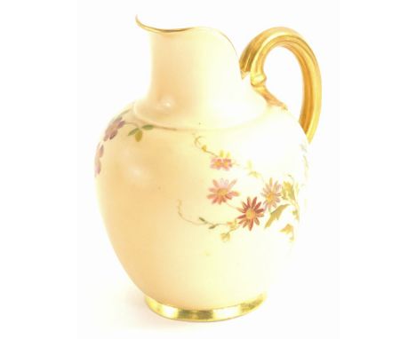 A Royal Worcester porcelain ewer or jug, painted with flowers on a blush ivory ground, printed marks in puce to underside and