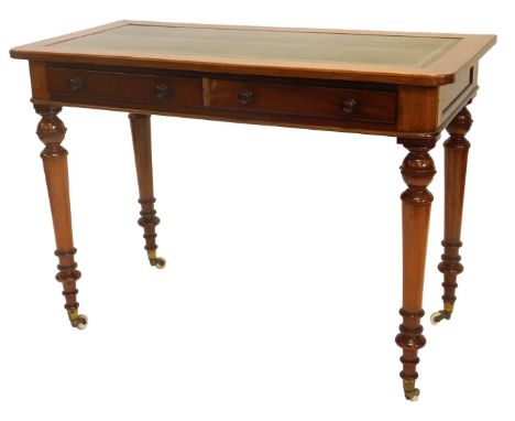 A Victorian mahogany writing table, the rectangular top with a later green leather insert, above two frieze drawers on turned