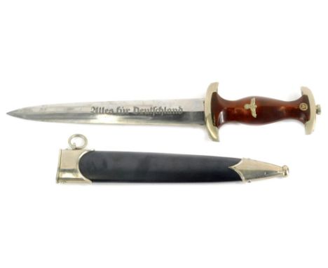 A Third Reich SA dagger, with emblem and eagle mounts to wooden handle, the blade stamped Alles Fur Deutschland and the maker