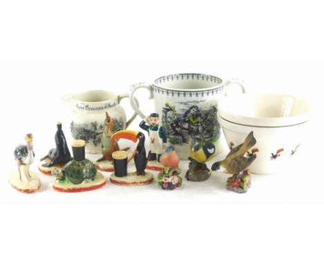 A collection of Carltonware Guinness figurines, a Taunton cider 1976 Wade commemorative two handled loving cup, an elephant p