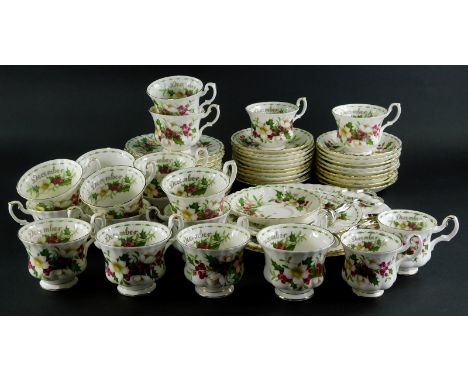 A Royal Albert Flowers of The Month December pattern part service, to include three tier cake stand, eighteen cups, other pla