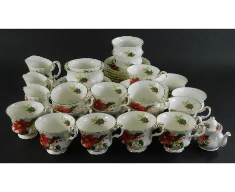 A Royal Albert Poinsettia part service, to include tea cups, miniature teapot, 7cm high, side plates, bowls, printed marks be