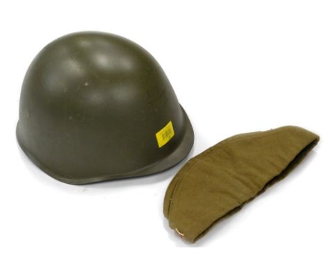 A green US Army Second World War type metal helmet, and a beret with Russian enamel badge.