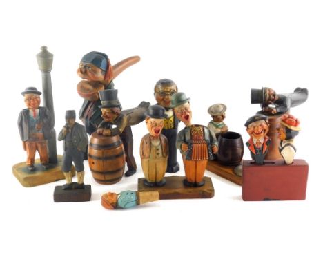A good and varied selection of continental carved articulated figures, to include cork screws, shoe brush, nutcracker formed 