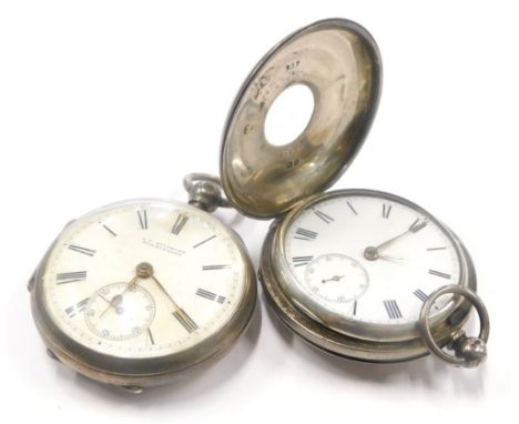 An early 20thC silver half hunter pocket watch, with blue enamel numerals, and a silver pocket watch, the dial stamped Swinbu