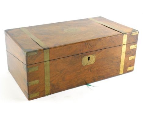 A 19thC mahogany and brass bound campaign writing box, the brass cartouche signed R Birch, 28 April 1888, enclosing a fitted 