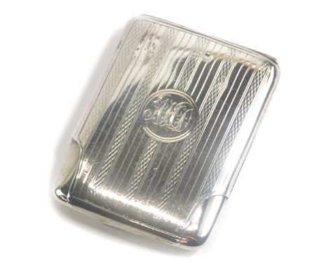 A George V silver match holder, of rectangular form with engine turned decoration and a monogrammed cartouche, Birmingham 192