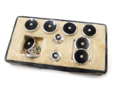 A cased set of gentleman's cuff links and collar studs, each with black enamel front with individual seed pearl, comprising p