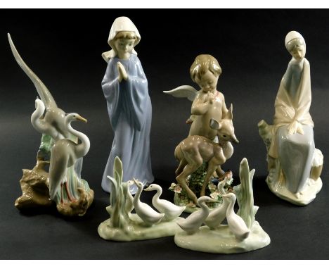 A Lladro porcelain figure of a putto, (AF),  figure of a fawn and various Nao figurines. (7)