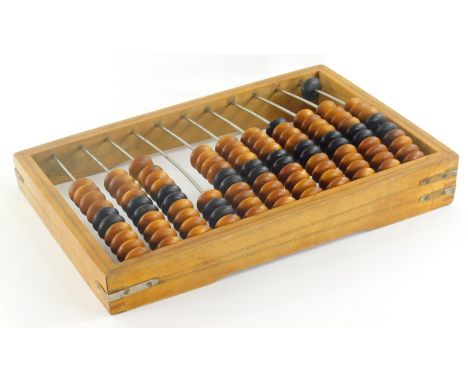 A 20thC beech abacus, of rectangular form, with various coloured beads and metal centre, 41cm wide.