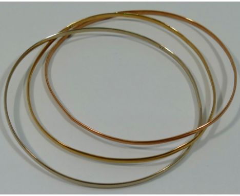 A Russian style tri-colour bangle, stamped '9KT', 11g gross, boxed  CONDITION REPORT: If you require further images of this l