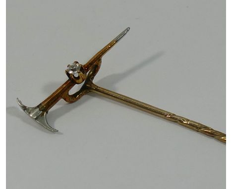 A gold diamond set prospector's stick pin in the form of a pick CONDITION REPORT: If you require further images of this lot o