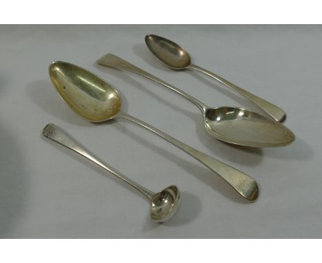 Four items of George III silver old English pattern cutlery comprised of a pair of dessert spoons, a tea spoon and a small sa